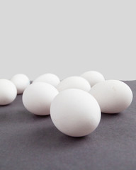 group of white eggs on grey