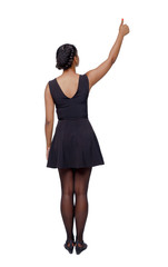 Back view of a black woman showing thumb up.
