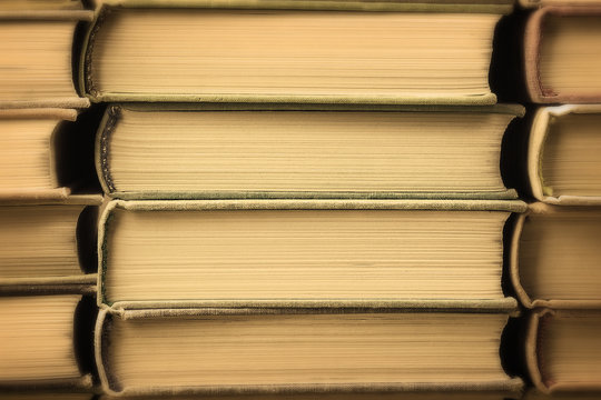 Many old books stacked in texture
