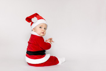Happy baby girl celebrating Christmas isolated on white background