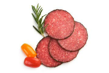 Smoked salami slices with herbs, isolated on a white background. Top view.