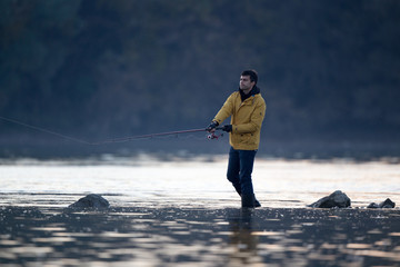 Man fishing in river