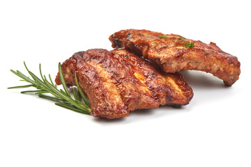Delicious Grilled Ribs with herbs, isolated on a white background. Close-up