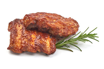 Pork Ribs Oven Baked Barbecue with herbs, isolated on a white background. Close-up