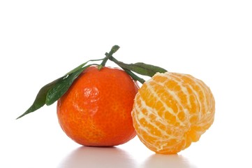 tangerines with leaves isolated on white background