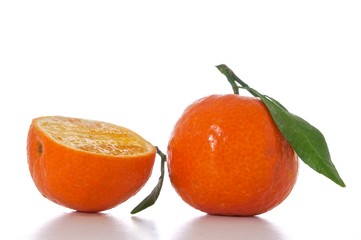 tangerine with green leaf isolated on white background