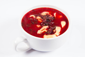 Traditional polish Christmas Eve dish: red borscht with uszka (a mushroom filled kind of dumplings)