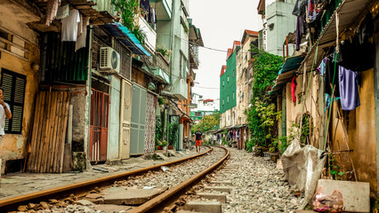 Fototapeta na wymiar A train track running through the street in Hanoi, Vietnam empty
