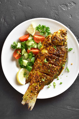 Roasted fish on plate