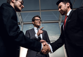 welcome and handshake of business people