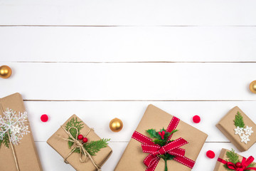 Christmas presents creative layout. White wood background whit copy space. Border arrangement. Flat...