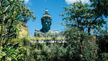 Tall statue at national park in Bali