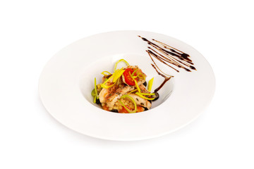 Plate of healthy steamed fish fillet with fresh vegetables isolated at white background.