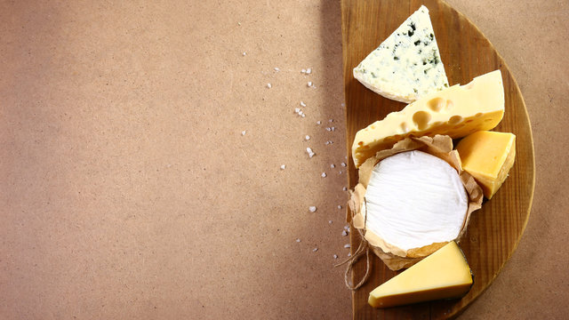 Food Banner, Cheese With Blue Mildew, Camembert Or Brie Cheese Circle, Gouda On Wooden Background. Flat Top View From Above. Copy Space, Set