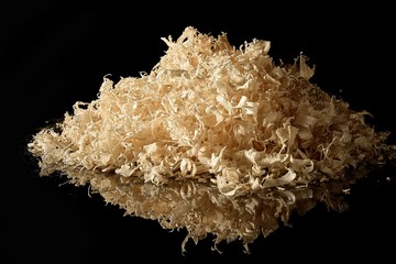 wood shavings on black glass with reflection. Can be used as background