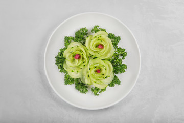 slices cucumber in a white  plate (beautiful shape), tasty food, carving