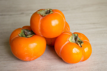 Fresh ripe persimmon, persimmon. Vitamins in the winter