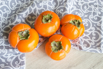 Fresh ripe persimmon, persimmon. Vitamins in the winter