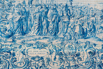 The side facade of Carmo Church is lined with a large panel of tiles, depicting scenes alluding to the foundation of the Carmelite Order