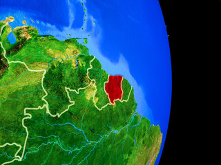 Suriname on realistic model of planet Earth with country borders and very detailed planet surface.