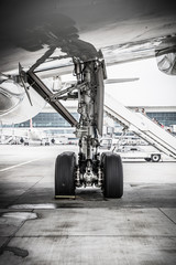Landing gear on ground, aircraft tires, airplane tires - obrazy, fototapety, plakaty