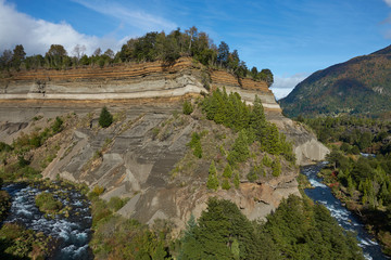 River Truful-Truful running through a deep gorge with colourful eroded cliffs in Conguillio National Park in the Araucania region of Chile