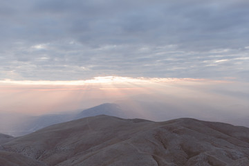 Sunset view from top of a mountain. View from Mount Nemrut, Turkey during golden hour. 