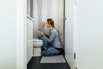 Mother and son in bathroom