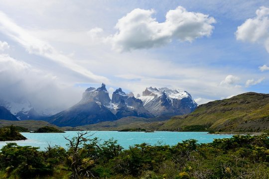 Cuernos del Paine massif with clouds on Lake Pehoe, Torres del Paine National Park, Ultima Esperanza Province, Chile, South America