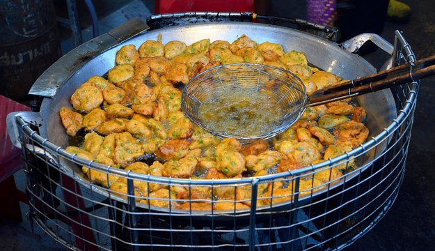 Typical fish cakes are fried, Naka Weekend Market, Phuket, Thailand, Asia