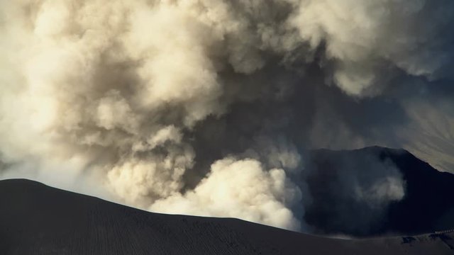 Active volcano Mt Bromo erupting smoke Java Indonesia South East Asia