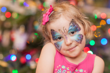 Cute girl with butterfly face paint