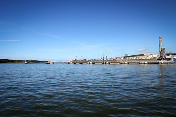 Fototapeta na wymiar Cranes of Klaipeda port and Baltic Sea view, Lithuania
