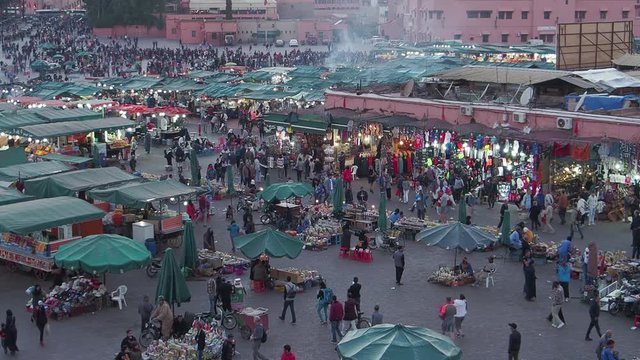 Crowds and activities in the afternoon in the main square, Jemaa el-Fnaa, in Marakesh, Morocco