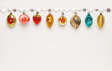 Antique Christmas toys on white wooden background