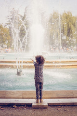 A child watching the musical fountain show in Margaret Island (Margitsziget), Budapest, Hungary.