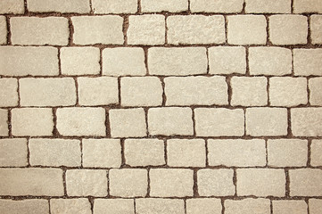 Old beige stone pavement background texture