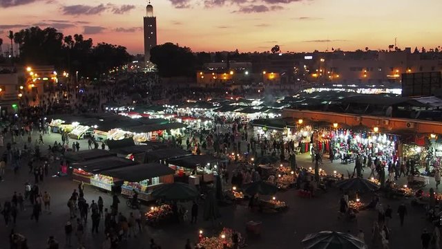 Twilight crowds and activities in the main square, Jemaa el-Fnaa, in Marakesh, Morocco