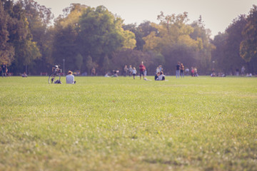 People enjoying the sunny warm weather and nature in Margaret Island, Budapest 