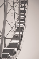 Low angle view of a ferris wheel, black and white photo