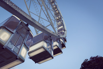 Low angle view of a ferris wheel with blue sky background 