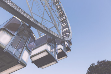 Low angle view of a ferris wheel with blue sky background 