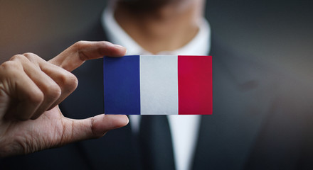 Businessman Holding Card of France Flag