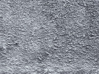 Weathered and dirty concrete wall texture background in black and white.