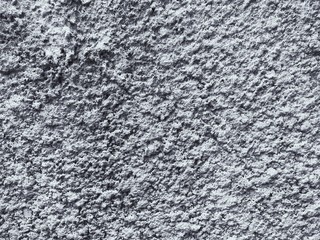 Weathered and dirty concrete wall texture background in black and white.