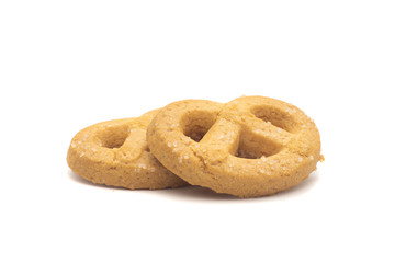 one side of two butter cookies on white background