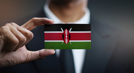 Businessman Holding Card of Kenya Flag