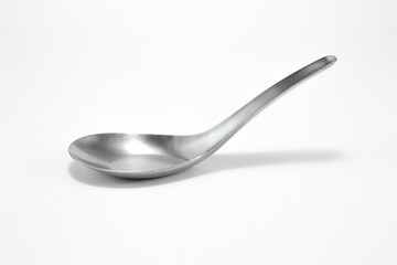 Stainless steel spoon on white background