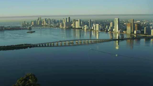 Aerial sunrise view of Julia Tuttle Causeway bridge Metropolitan Downtown Miami Skyline Biscayne Bay Florida USA 