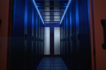 Corridor is the date of the center. walls with servers in cabine